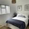 Centrally located modern 2-bedroom home & parking