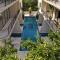 2BR with Fast WiFi FREE BIKES, Rooftop, Pool, and Gym