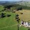 The Granary at Pentregaer Ucha, tennis court & lake. - Oswestry