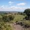 In a wonderful medieval village on the Tuscan hills, with air conditioning