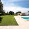 Three suites villa with pool and trulli .