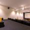 Grande Montana by StayVista - Luxurious Hillside Villa featuring Pool, Theater, and Games Room