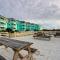 1st-floor pool-view condo with outdoor pool, beach access, balcony, W/D, & AC