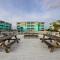 1st-floor pool-view condo with outdoor pool, beach access, balcony, W/D, & AC