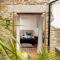 Water Mill at East Trenean Farm -Luxury Cornish Cottage sleeping 4 with hot tub, private garden, rural views and EV facilities