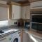 E31 is a 2 bedroom 6 berth caravan with large decking and close to beach on Whitehouse Leisure Park This is a pet free caravan - 阿贝尔格莱