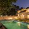 StayVistas Enchanting Haven - Modern Interiors, Sprawling Lawn with Gazebo, Swimming Pool, Indoor Games