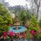 StayVistas Chimney Cottage with Sprawling Lawns, Picturesque Views, Plunge Pool, Jacuzzi, and Home Theatre