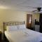 JI10, a Queen Guest Room at the Joplin Inn, at the entrance to Mountain Harbor Resort Hotel Room