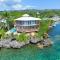 Awesome over the water overlooking West End - Aire Agua home