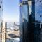2BR CBD pad, city views, free parking, pool, gym