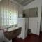 Casa de Huéspedes Muñiz sobre parque de 1000m2, 1 dormitorio, 20m2 cubiertos, baño con ducha, pileta cilíndrica de 3x076 - Муньис