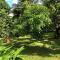 F3 dans maison individuelle avec jardin arboré