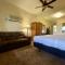 Lake view queen guest room with two queens, sleeper sofa and patio overlooking Lake Ouachita, Hotel Room - Mount Ida