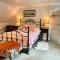Traditional farm cottage with woodburner by stream
