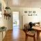 Traditional farm cottage with woodburner by stream