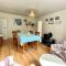 Traditional farm cottage with woodburner by stream