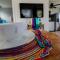 Somewhere over the Rainbow Loft with AC Hilo