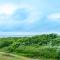 Vue sur mer, dunes et golf