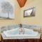 Blissful Broken Bow Studio Fire Pit and Jacuzzi Tub