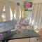 Home Style Apartments - 1 & 3 BR Suites with Full Kitchen