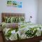 The Palm Leaf Apartments