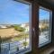 Modern sunshine yellow apartment with nature views - Willemstad