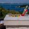 Uniquely designed Villa Ivana with outdoor Jacuzzi nearby the pebble Banje beach at the Island of Solta