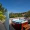 Uniquely designed Villa Ivana with outdoor Jacuzzi nearby the pebble Banje beach at the Island of Solta