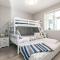 Lovely 2 bedroom suite steps from The beach