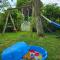7 person House with swing, firepit, hammock, garden, swimming lake, child friendly, in- and outside playground, and great coffee - Ewijk