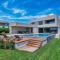 Luxury beachside villa with a pool and a sea view