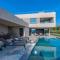 Luxury beachside villa with a pool and a sea view