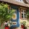 Haus am Hafen - Kaminfeeling und Luxus unter Reet