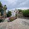 THE ROCK HOUSE - Beautiful countryside with mandarins oranges and olive trees,. Near Limassol at Eptagonia village.