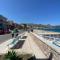 Terrace under Taormina just a few minutes walk to the free beach and downtown!