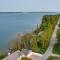 Lakefront De Tour Village Home with Deck and Fire Pit!