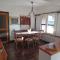 Villa La Lecceta surrounded by greenery and sea view with sunset