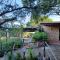 Villa La Lecceta surrounded by greenery and sea view with sunset