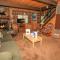 Cardinal Ridge - Rustic cabin with stellar outdoor features! Wrap-around deck and large yard!