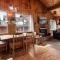 Forest Edge Retreat - Cozy, log cabin with a wood burning fireplace! Pool Table, Foosball and Darts!
