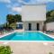 Luxury, seafront Villa Petra with heated pool only 50m from beach