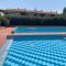 Appartamento con piscina e campi da tennis