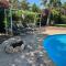 Mediterranean poolside garden cottage