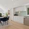 Luxurious Waterfront North Facing 5 bedroom House with pool, pontoon and Deep Water Access near Mooloolaba