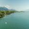 Apartment on Lake Garda with pebble beach pier for boat three swimming pools