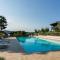 Apartment on Lake Garda with pebble beach pier for boat three swimming pools