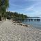 Apartment on Lake Garda with pebble beach pier for boat three swimming pools