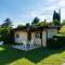 Apartment on Lake Garda with pebble beach pier for boat three swimming pools