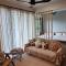 Unique Boho Style Condo with NETFLIX for up to 5PAX - Enjoy Mountain View while swimming at the Infinity Pool & Natural Hotspring Pool, 2mins walk to the Lost World of Tambun, Water Themepark at IPOH